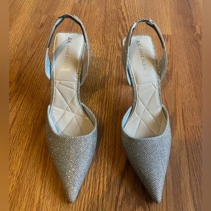 Brand new silver sling back heels